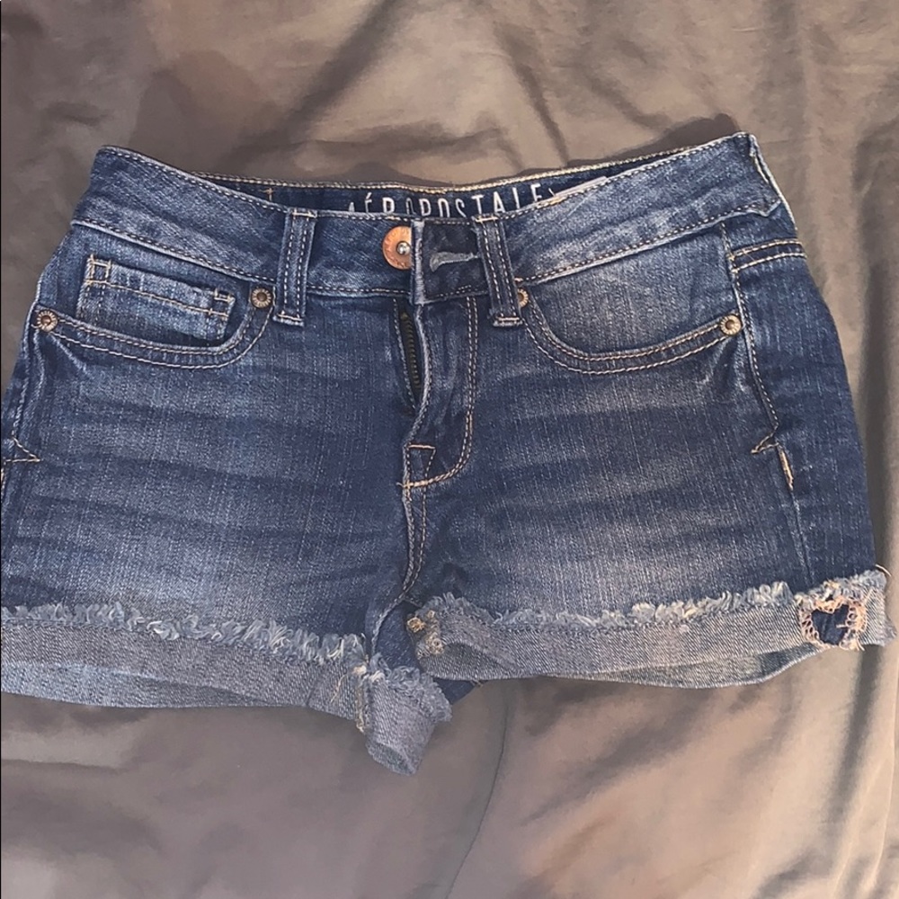 Medium wash jean shorts.